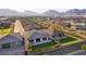 Wide aerial shot of a neighborhood featuring modern homes with beautiful landscaping at 218 Vista Balla Ave, Las Vegas, NV 89138