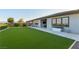 Lush backyard features a well-manicured lawn, modern patio, and outdoor living space at 218 Vista Balla Ave, Las Vegas, NV 89138