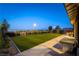 Expansive backyard with manicured lawn, privacy fencing and open-air seating area at 218 Vista Balla Ave, Las Vegas, NV 89138