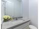 Modern bathroom featuring stylish gray countertop and a large mirror at 218 Vista Balla Ave, Las Vegas, NV 89138