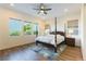 Charming bedroom with a four-poster bed, hardwood floors, and great natural light at 218 Vista Balla Ave, Las Vegas, NV 89138