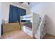 bedroom featuring bunk beds, drawer storage, and a neutral color scheme at 218 Vista Balla Ave, Las Vegas, NV 89138