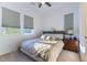 Cozy bedroom with a comfortable bed, soft carpet, and bright natural light at 218 Vista Balla Ave, Las Vegas, NV 89138