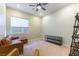 Cozy bedroom featuring comfortable seating and a ceiling fan at 218 Vista Balla Ave, Las Vegas, NV 89138