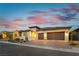 Beautiful single-Gathering home with a two-car garage, brick driveway, and landscaped front yard at 218 Vista Balla Ave, Las Vegas, NV 89138