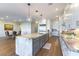 Spacious kitchen with a large island, stainless steel appliances, and stylish pendant lighting, open to dining area at 218 Vista Balla Ave, Las Vegas, NV 89138
