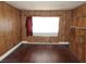 Bedroom featuring wood paneling, hardwood floors and built in shelving at 2813 Willoughby Ave, Las Vegas, NV 89101