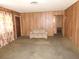 Inviting living room with wood panel walls, carpet, and a comfortable sofa at 2813 Willoughby Ave, Las Vegas, NV 89101
