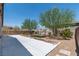Spacious backyard features a large concrete patio and a shaded seating area under a trellis at 3012 Chiefs Ct, North Las Vegas, NV 89032