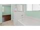 Bright bathroom featuring a soaking tub and glass-enclosed shower at 3012 Chiefs Ct, North Las Vegas, NV 89032