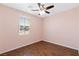 Cozy bedroom with natural light and wood flooring at 3012 Chiefs Ct, North Las Vegas, NV 89032