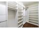 Walk-in closet with custom shelving and hanging rods at 3012 Chiefs Ct, North Las Vegas, NV 89032