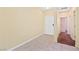 Bright hallway featuring neutral walls, tile flooring, and white doors leading to other rooms at 3012 Chiefs Ct, North Las Vegas, NV 89032