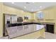 Modern kitchen with stainless steel appliances, granite counters, and recessed lighting at 3012 Chiefs Ct, North Las Vegas, NV 89032