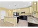 Beautiful kitchen with granite island, stainless steel appliances, and open layout at 3012 Chiefs Ct, North Las Vegas, NV 89032