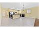 Bright, open kitchen with modern appliances, granite countertops, and a tile floor at 3012 Chiefs Ct, North Las Vegas, NV 89032