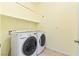 Convenient laundry room features a newer front-load washer and dryer and overhead shelving at 3012 Chiefs Ct, North Las Vegas, NV 89032