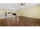 Open-concept living space with hardwood floors, recessed lighting, and a view of the kitchen at 3012 Chiefs Ct, North Las Vegas, NV 89032