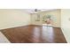 Spacious living room featuring hardwood floors and sliding glass doors opening to the backyard at 3012 Chiefs Ct, North Las Vegas, NV 89032