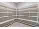 Spacious walk-in pantry with ample shelving for storage at 3012 Chiefs Ct, North Las Vegas, NV 89032