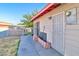 The backyard shows a side view of the house with a door with a security screen at 304 Perkins Cir, Las Vegas, NV 89106