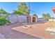 The backyard contains a brick fire pit, a block wall, and a small storage shed at 304 Perkins Cir, Las Vegas, NV 89106