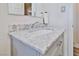 Bathroom vanity showcases a marble countertop, gray cabinets, and modern fixtures at 304 Perkins Cir, Las Vegas, NV 89106