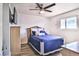 Cozy bedroom with wood-look flooring, ceiling fan and nice natural light at 304 Perkins Cir, Las Vegas, NV 89106