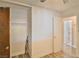 This bedroom features a closet with a wood door and well maintained floors and walls at 304 Perkins Cir, Las Vegas, NV 89106