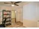 This is a well-lit bedroom featuring a ceiling fan and closet space with wood laminate flooring at 304 Perkins Cir, Las Vegas, NV 89106