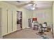 This spacious bonus room has large windows, ceiling fan, carpet flooring, and tons of potential at 304 Perkins Cir, Las Vegas, NV 89106
