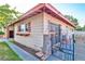 Charming exterior view highlighting the home's unique design and secure, gated access at 304 Perkins Cir, Las Vegas, NV 89106