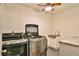 This laundry room features a modern washer and dryer and a stainless steel sink at 304 Perkins Cir, Las Vegas, NV 89106