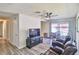 Open-concept living room featuring modern flooring, a dining area, and plenty of space for relaxation at 304 Perkins Cir, Las Vegas, NV 89106