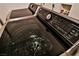 Close up of a sleek, modern, stainless steel washing machine at 304 Perkins Cir, Las Vegas, NV 89106