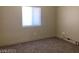 Neutral bedroom with a window, carpeting and electrical outlets ready for personalization at 31 White Burch Ln, Pahrump, NV 89048