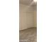 Bedroom showcasing neutral flooring and a closet featuring sliding doors at 31 White Burch Ln, Pahrump, NV 89048
