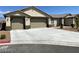 Beautiful single-story home with a spacious driveway and attached two-car garage at 31 White Burch Ln, Pahrump, NV 89048