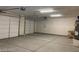 Attached two-car garage featuring ample space and storage, with two overhead doors at 31 White Burch Ln, Pahrump, NV 89048