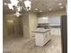 Stylish open-concept kitchen with an island, stainless steel appliances, and ample cabinet space at 31 White Burch Ln, Pahrump, NV 89048
