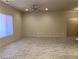 Bright and airy living room with neutral walls, wood-look flooring, and lots of natural light at 31 White Burch Ln, Pahrump, NV 89048