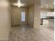 Spacious living area with open floor plan concept flowing into the modern kitchen with stainless appliances at 31 White Burch Ln, Pahrump, NV 89048