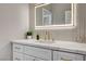 Elegant bathroom with a lighted mirror, marble countertop, and modern fixtures at 3218 Squire St, Las Vegas, NV 89135