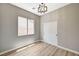 Well-lit bedroom featuring a closet with sliding doors, neutral paint, and modern lighting at 3218 Squire St, Las Vegas, NV 89135