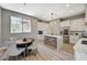 Spacious kitchen with an island, breakfast bar, modern appliances, and an adjacent dining area at 3218 Squire St, Las Vegas, NV 89135