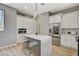 Island kitchen featuring an island with bar stool seating and stainless steel appliances at 3218 Squire St, Las Vegas, NV 89135