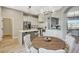 Well-designed kitchen with marble countertops, stainless steel appliances, and a cozy breakfast area at 3218 Squire St, Las Vegas, NV 89135