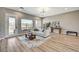 Bright living room with hardwood floors, stylish furniture, and natural light, perfect for relaxation at 3218 Squire St, Las Vegas, NV 89135