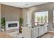 Bright living room featuring fireplace, modern wall design, plush seating, and stylish decor at 3218 Squire St, Las Vegas, NV 89135