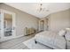 Bedroom featuring hardwood floors, neutral paint, decor, and large windows at 3218 Squire St, Las Vegas, NV 89135
